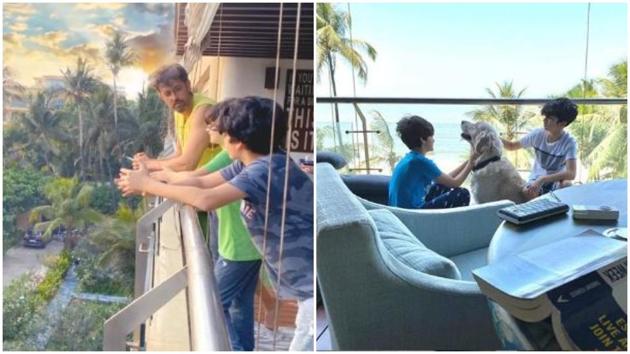 Hrithik Roshan and his sons click pictures and play with their dog in their balcony. Hrithik Roshan and his sons click pictures and play with their dog in their balcony.