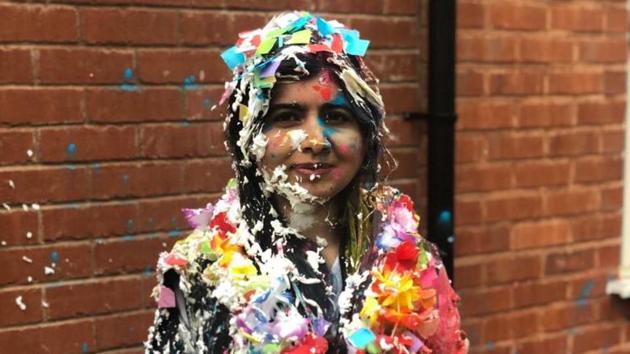 The image shows Malala Yousafzai covered in cake and confetti. (Twitter/@Malala) The image shows Malala Yousafzai covered in cake and confetti. (Twitter/@Malala)