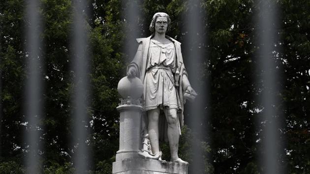 A statue of Christopher Columbus is seen through a barricade at Marconi Plaza, Monday, June 15, 2020, in the South Philadelphia neighborhood of Philadelphia. (AP) A statue of Christopher Columbus is seen through a barricade at Marconi Plaza, Monday, June 15, 2020, in the South Philadelphia neighborhood of Philadelphia. (AP)