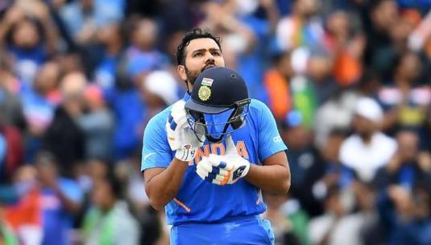 India's Rohit Sharma celebrates after scoring a century (100 runs) during the 2019 Cricket World Cup group stage match between India and Pakistan at Old Trafford in Manchester, northwest England, on June 16, 2019.(AFP)