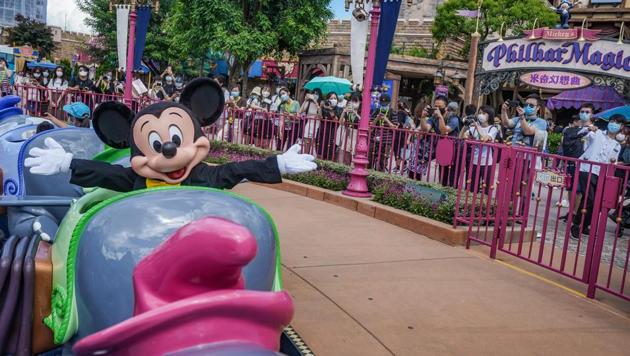 An actor dressed as Mickey Mouse sit on the Dumbo the Flying Elephant ride in Fanasyland at Walt Disney Co.'s Disneyland Resort in Hong Kong, China, on Thursday, June 18, 2020. (Bloomberg) An actor dressed as Mickey Mouse sit on the Dumbo the Flying Elephant ride in Fanasyland at Walt Disney Co.'s Disneyland Resort in Hong Kong, China, on Thursday, June 18, 2020. (Bloomberg)