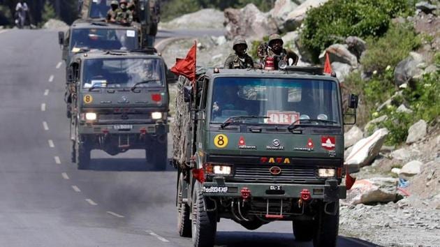 An Indian Army convoy moves along a highway leading to Ladakh, at Gagangeer in Kashmir's Ganderbal district, on June 18.(Reuters Photo)