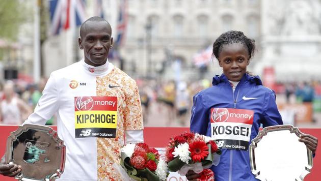 FILE - In this Sunday, April 28, 2019 file photo, women's race winner Kenya's Brigid Kosgei, right, and men's race winner Kenya's Eliud Kipchog pose after the 39th London Marathon in London.(AP)