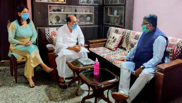 Union law and IT minister Ravi Shankar Prasad met late Bollywood actor Sushant Singh Rajput's father Krishna Kumar Singh at his residence in Patna on Friday.(PTI PHOTO.)