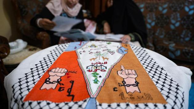 Um Zeid, 47 year-old, and Khawla 48 year-old, Palestinian refugees women living in Jordan embroider a traditional Palestinian dresses for customers at Al-Baqaa Palestinian refugee camp, near Amman, Jordan. (REUTERS)