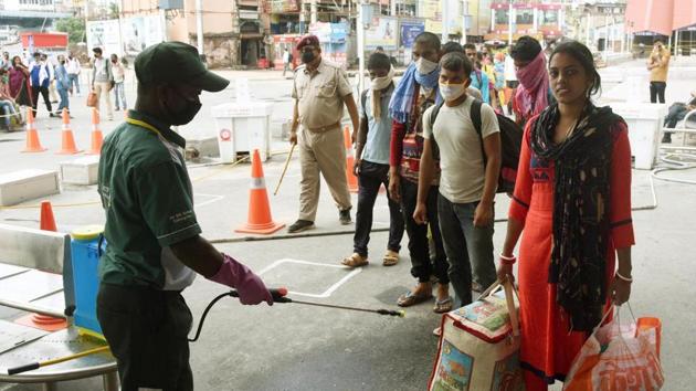 A worker sanitising travellers’ luggage at Patna Junction railway station, on Friday June 19, 2020.(Santosh Kumar / HT Photo) A worker sanitising travellers’ luggage at Patna Junction railway station, on Friday June 19, 2020.(Santosh Kumar / HT Photo)