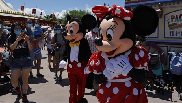 The iconic cartoon characters Minnie and Mickey Mouse walk with the visitors at the Hong Kong Disneyland. (AP) The iconic cartoon characters Minnie and Mickey Mouse walk with the visitors at the Hong Kong Disneyland. (AP)