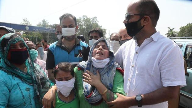 The relatives of the deceased men are seen grief-stricken during a protest held at Gangyal, Jammu on Saturday. (HT Photo) The relatives of the deceased men are seen grief-stricken during a protest held at Gangyal, Jammu on Saturday. (HT Photo)