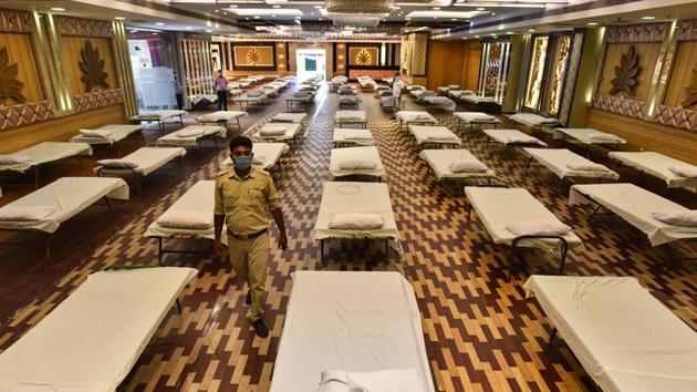 Rows of beds line a hall at the Shubh Nimantran banquet hall in Kirti Nagar. Delhi will need at least 15,000 beds to treat those who are severely ill by the end of June. Currently, the city has 12,208 beds earmarked for treating Covid-19 patients and makeshift hospitals are being set up in stadiums and banquet halls to increase bed strength to match the projection needed by the end of the month, reported HT. (Sanchit Khanna / HT Photo) Rows of beds line a hall at the Shubh Nimantran banquet hall in Kirti Nagar. Delhi will need at least 15,000 beds to treat those who are severely ill by the end of June. Currently, the city has 12,208 beds earmarked for treating Covid-19 patients and makeshift hospitals are being set up in stadiums and banquet halls to increase bed strength to match the projection needed by the end of the month, reported HT. (Sanchit Khanna / HT Photo)