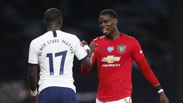 Tottenham Hotspur's Moussa Sissoko with Manchester United's Paul Pogba after the match, as play resumes behind closed doors following the outbreak of the coronavirus disease.(REUTERS)