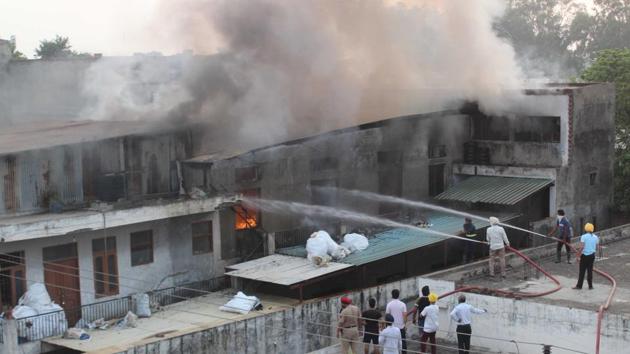 Firefighters trying to douse flames at a factory in the Industrial Area, Phase 9, Mohali, on Saturday. (Gurminder Singh/HT) Firefighters trying to douse flames at a factory in the Industrial Area, Phase 9, Mohali, on Saturday. (Gurminder Singh/HT)