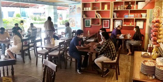 Customers at a cafe at Elante Mall in Chandigarh on Saturday.(HT Photo) Customers at a cafe at Elante Mall in Chandigarh on Saturday.(HT Photo)