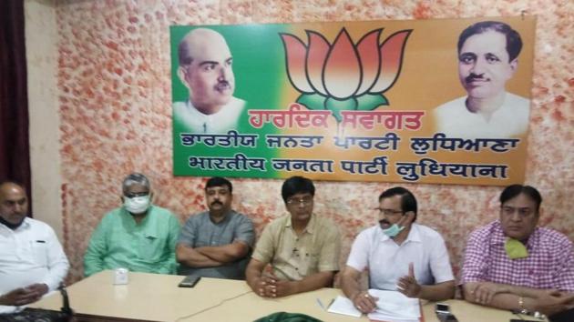 Members from city unit of BJP exposing the alleged scam during a press conference in Ludhiana on Sunday. (HT Photo) Members from city unit of BJP exposing the alleged scam during a press conference in Ludhiana on Sunday. (HT Photo)