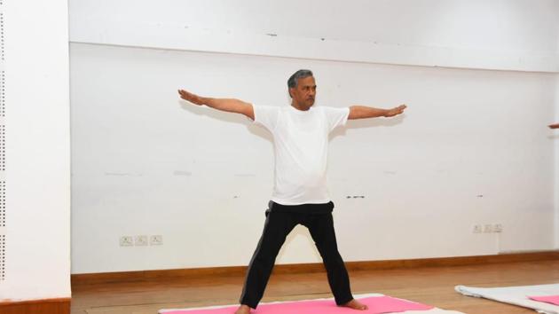 Chief minister Rawat performing yoga at his residence in Dehradun on Sunday. (HT Photo) Chief minister Rawat performing yoga at his residence in Dehradun on Sunday. (HT Photo)