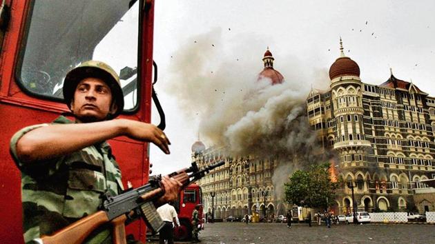 A soldier takes cover as a gun battle with terrorists rages at the Taj Mahal hotel, Mumbai, on November 29, 2008. (AP file) A soldier takes cover as a gun battle with terrorists rages at the Taj Mahal hotel, Mumbai, on November 29, 2008. (AP file)