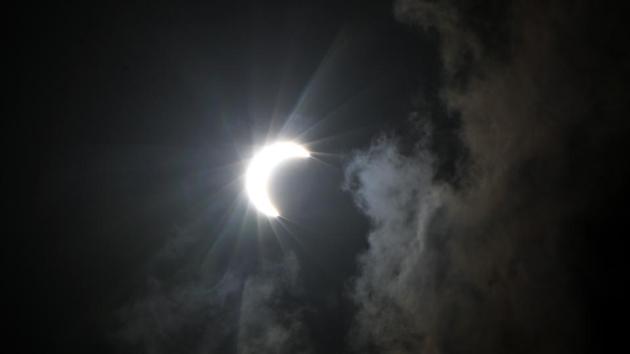A bright crescent sun shines in the sky during the annular solar eclipse, seen from Bhatinda. (Sanjeev Kumar / HT Photo) A bright crescent sun shines in the sky during the annular solar eclipse, seen from Bhatinda. (Sanjeev Kumar / HT Photo)