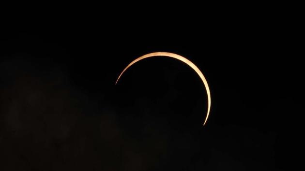 A crescent sun shines in the sky as the moon partially covers the sun during the annular solar eclipse, seen from Chandigarh on June 21. (Ravi Kumar / HT Photo) A crescent sun shines in the sky as the moon partially covers the sun during the annular solar eclipse, seen from Chandigarh on June 21. (Ravi Kumar / HT Photo)