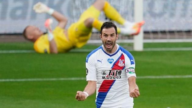 Crystal Palace's Luka Milivojevic celebrates scoring their first goal as play resumes behind closed doors following the outbreak of the coronavirus disease (COVID-19).(REUTERS)