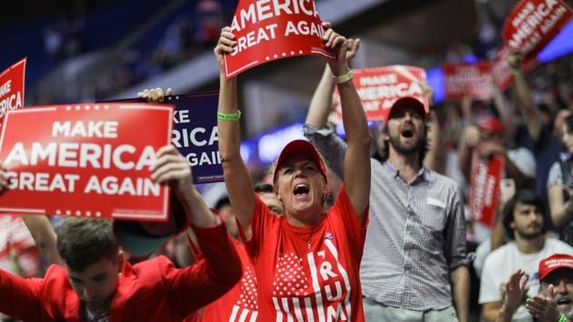 Supporters of US President Donald Trump scream and cheer without protective masks as the president addresses his first re-election campaign rally in several months in the midst of the coronavirus disease outbreak, at the BOK Center in Tulsa, Oklahoma. (REUTERS) Supporters of US President Donald Trump scream and cheer without protective masks as the president addresses his first re-election campaign rally in several months in the midst of the coronavirus disease outbreak, at the BOK Center in Tulsa, Oklahoma. (REUTERS)