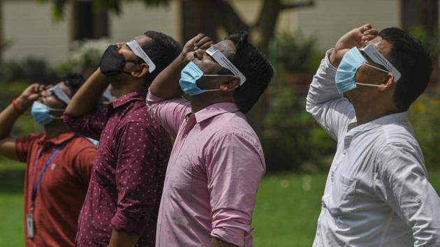 People line up as they watch the solar eclipse at Nehru Planetarium in New Delhi. The solar eclipse on June 21 is the 23rd such celestial event in a decade, according to US space agency NASA’s website on eclipses. (Biplov Bhuyan / HT Photo) People line up as they watch the solar eclipse at Nehru Planetarium in New Delhi. The solar eclipse on June 21 is the 23rd such celestial event in a decade, according to US space agency NASA’s website on eclipses. (Biplov Bhuyan / HT Photo)