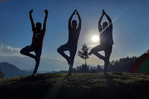 Jammu: Fitness enthusiasts perform yoga on the eve of International Day of Yoga, at Bhaderwah in Jammu, Saturday, June 20, 2020.(PTI)