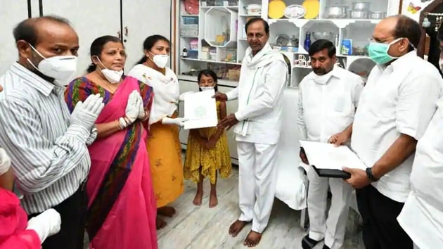 Telangana CM K Chandrasekhar Rao handing over a cheque for Rs 5 crore and an appointment letter as Group-1 officer to Santoshi, wife of Colonel Santosh Babu at Suryapet on Monday, June 22.(HT Photo) Telangana CM K Chandrasekhar Rao handing over a cheque for Rs 5 crore and an appointment letter as Group-1 officer to Santoshi, wife of Colonel Santosh Babu at Suryapet on Monday, June 22.(HT Photo)