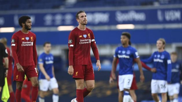 Liverpool's Jordan Henderson leaves the field at the end of the English Premier League soccer match between Everton and Liverpool at Goodison Park in Liverpool, England, Sunday, June 21, 2020. (AP photo/Shaun Botterill, Pool)(AP)