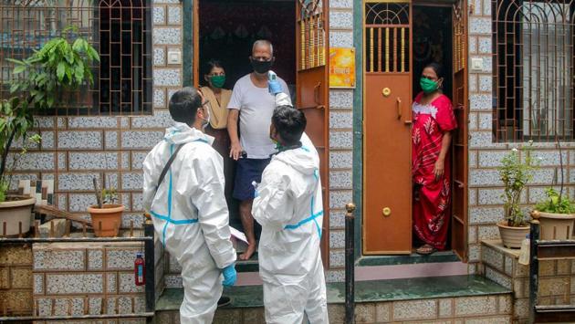 Health workers in PPE bodysuits during a door-to-door screening exercise in Tanaji Nagar, Mumbai on June 20. Maharashtra is currently dealing with a high case fatality rate (CFR) of 4.67%, much above the national rate of 3.28%.The state government had on May 31 vowed to bring it down to below 3% but the rate has risen in part due to the data reconciliation exercise this month. (PTI)