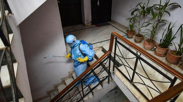A municipal worker disinfects a residential building in a containment zone in New Delhi on June 22. Globally, 9.1 million people have contracted Covid-19 and 472,050 have died so far according to the worldometers tracker. The World Health Organization chalked June 21 as the largest single-day increase in cases at more than 183,000. That coincided with India’s sharpest rise in deaths day over day at 427. (Amal KS / HT Photo)