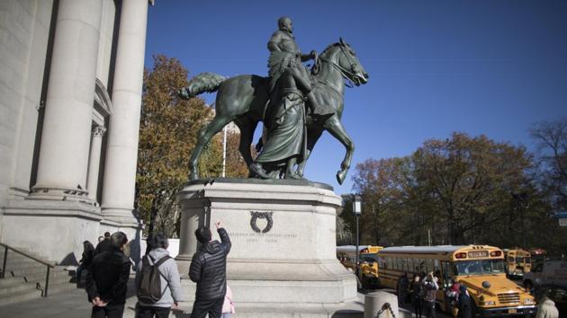 The bronze statue that has stood at the museum’s Central Park West entrance since 1940 depicts Roosevelt on horseback with a Native American man and an African man standing next to the horse.(AP file photo) The bronze statue that has stood at the museum’s Central Park West entrance since 1940 depicts Roosevelt on horseback with a Native American man and an African man standing next to the horse.(AP file photo)