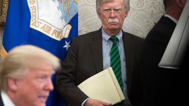 (File photo: Former National Security Adviser John Bolton stands alongside US President Donald Trump. (AFP) (File photo: Former National Security Adviser John Bolton stands alongside US President Donald Trump. (AFP)