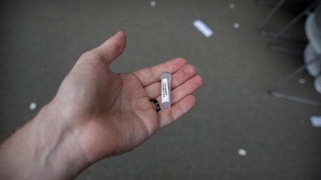 Soon after a cluster of cases emerged at the market, photographer Mark Schiefelbein got a call from his neighbourhood’s community association asking him “to report to the gates of a nearby sports stadium to be transported to a coronavirus testing site.” The official did not know Schiefelbein’s name, but his location was traced using his cell phone number. (Mark Schiefelbein / AP) Soon after a cluster of cases emerged at the market, photographer Mark Schiefelbein got a call from his neighbourhood’s community association asking him “to report to the gates of a nearby sports stadium to be transported to a coronavirus testing site.” The official did not know Schiefelbein’s name, but his location was traced using his cell phone number. (Mark Schiefelbein / AP)