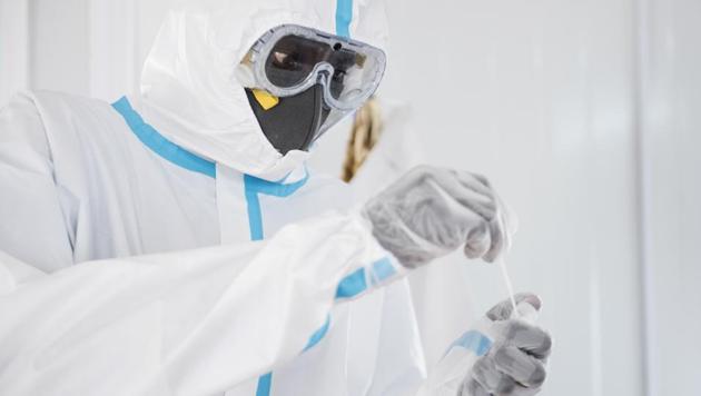 In this photo taken Sunday, June 21, 2020, an infectious disease specialist takes a sample from a coronavirus patient under quarantine at the Dr John Garang Infectious Diseases Unit in Juba, South Sudan. (Representtional) (AP) In this photo taken Sunday, June 21, 2020, an infectious disease specialist takes a sample from a coronavirus patient under quarantine at the Dr John Garang Infectious Diseases Unit in Juba, South Sudan. (Representtional) (AP)