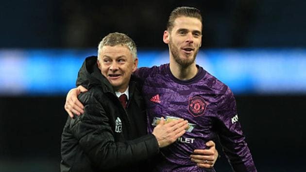 Ole Gunnar Solskjaer (left) and goalkeeper David de Gea react after the final whistle during a Premier League match. (Getty Images)
