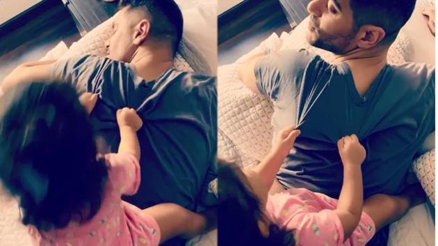 Neha Dhupia’s daughter sits on father Angad Bedi to wake him up.