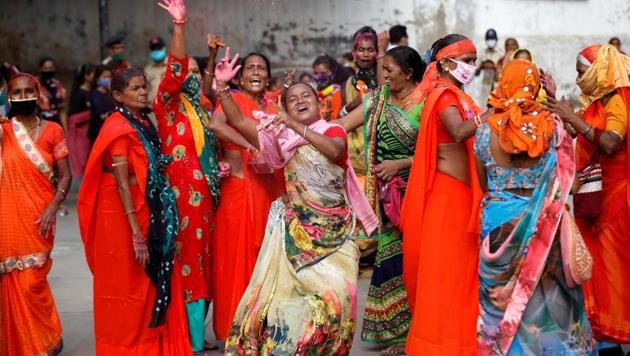 Hindu devotees dance as they arrive to attend the annual Rath Yatra, or chariot procession, amidst the coronavirus disease (COVID-19) outbreak, in Ahmedabad, India, June 23, 2020.(REUTERS)