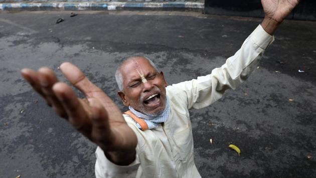 A Hindu devotee reacts after ISKCON (International Society of Krishna Consciousness) cancelled the annual Rath Yatra, or chariot procession, amidst the coronavirus disease (COVID-19) outbreak, in Kolkata, India on Tuesday, June 23, 2020. (REUTERS) 