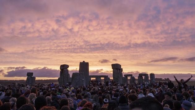 FILE - In this Sunday, June 21, 2015 file photo, the sun rises as thousands of revellers gather at the ancient stone circle Stonehenge to celebrate the Summer Solstice, the longest day of the year, near Salisbury, England. (AP Photo/Tim Ireland, File) FILE - In this Sunday, June 21, 2015 file photo, the sun rises as thousands of revellers gather at the ancient stone circle Stonehenge to celebrate the Summer Solstice, the longest day of the year, near Salisbury, England. (AP Photo/Tim Ireland, File)