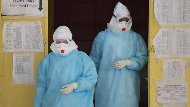 Medics wearing Personal Protective Equipment (PPE) suits coming out of the Covid-19 ward of Victoria Hospital, during the ongoing nationwide lockdown, in Bengaluru, Wednesday, June 17, 2020.(PTI photo)