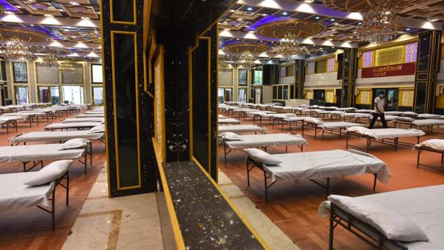Beds placed in the hall at a Weddingz.in Banquet facility which has been requisitioned for use as a Covid-19 care centre in Kirti Nagar, New Delhi on June 22. A government official told HT that the June 21 review noted that 57% of Delhi’s Covid-19 cases are coming from either clusters or containment zones. (Sanchit Khanna / HT Photo) Beds placed in the hall at a Weddingz.in Banquet facility which has been requisitioned for use as a Covid-19 care centre in Kirti Nagar, New Delhi on June 22. A government official told HT that the June 21 review noted that 57% of Delhi’s Covid-19 cases are coming from either clusters or containment zones. (Sanchit Khanna / HT Photo)