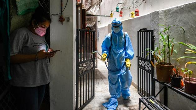 A municipal worker in PPE disinfects a home in the Arjun Nagar containment zone in New Delhi on June 22. The Centre and the Delhi government agreed on June 21 to revamp the national capital’s action plan to control the spread of the coronavirus disease (Covid-19) laying special emphasis on effective containment zones and contact tracing. (Amal KS / HT Photo) A municipal worker in PPE disinfects a home in the Arjun Nagar containment zone in New Delhi on June 22. The Centre and the Delhi government agreed on June 21 to revamp the national capital’s action plan to control the spread of the coronavirus disease (Covid-19) laying special emphasis on effective containment zones and contact tracing. (Amal KS / HT Photo)