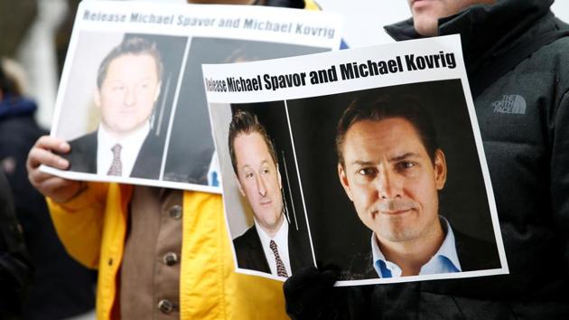 People hold signs calling for China to release Canadian detainees Michael Spavor and Michael Kovrig during an extradition hearing for Huawei Technologies Chief Financial Officer Meng Wanzhou at the B.C. Supreme Court in Vancouver, British Columbia, Canada.(REUTERS) People hold signs calling for China to release Canadian detainees Michael Spavor and Michael Kovrig during an extradition hearing for Huawei Technologies Chief Financial Officer Meng Wanzhou at the B.C. Supreme Court in Vancouver, British Columbia, Canada.(REUTERS)