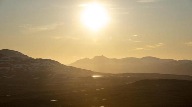 The midnight sun shines at the border area between Finland and Norway, in Enonteki', northern Finland, in the night between Sunday and early Monday June 22, 2020. Sunday June 21 marked the summer solstice in the northern hemisphere, as in the northernmost parts of Finland the midnight sun does not set below the horizon. (Otto Ponto/Lehtikuva via AP) The midnight sun shines at the border area between Finland and Norway, in Enonteki', northern Finland, in the night between Sunday and early Monday June 22, 2020. Sunday June 21 marked the summer solstice in the northern hemisphere, as in the northernmost parts of Finland the midnight sun does not set below the horizon. (Otto Ponto/Lehtikuva via AP)