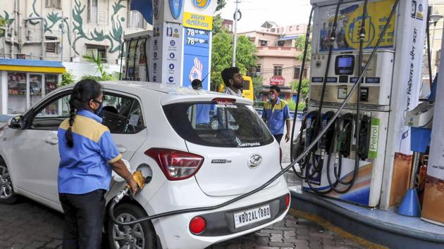 An employee fills fuel in a vehicle at a filling station, in Kolkata. (PTI) An employee fills fuel in a vehicle at a filling station, in Kolkata. (PTI)
