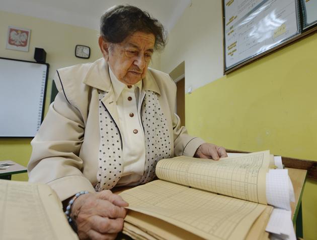 Former teacher Halina Dobek, 87, looks through the school reports of the North Korean war orphans whom she taught the Polish language in 1956-57, in Otwock, Poland. During and after the 1950-53 Korean War, North Korea sent thousands of orphans it couldn’t feed to Eastern European communist allies. The children entered schools in Poland, Bulgaria, Romania and elsewhere, forming friendships, studying, playing. Then several years later they were all abruptly ordered to return home. (AP)