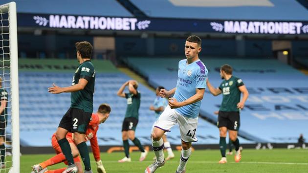 Soccer Football - Premier League - Manchester City v Burnley - Etihad Stadium, Manchester, Britain - June 22, 2020 Manchester City's Phil Foden celebrates scoring their fifth goal, as play resumes behind closed doors following the outbreak of the coronavirus disease (COVID-19) Michael Regan/Pool via REUTERS EDITORIAL USE ONLY. No use with unauthorized audio, video, data, fixture lists, club/league logos or "live" services. Online in-match use limited to 75 images, no video emulation. No use in betting, games or single club/league/player publications. Please contact your account representative for further details.(REUTERS)