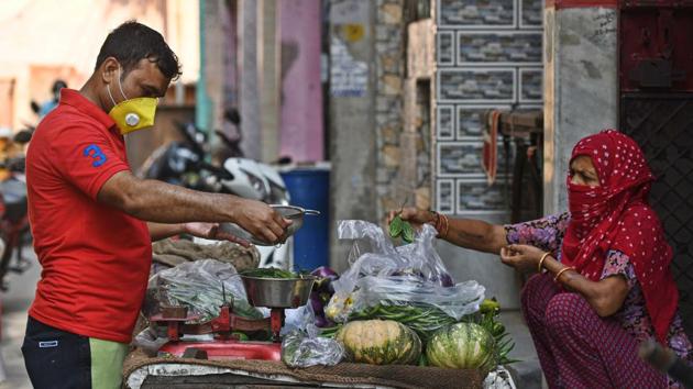Vajir Singh, who was an English teacher prior to lockdown sells vegetables at Sultanpuri in New Delhi, India, on Monday, June 22, 2020.(Biplov Bhuyan/HT photo)