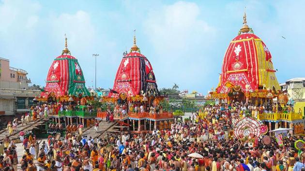 Priests and devotees take part in rituals of Lord Jagannath Rath Yatra in Puri, on Tuesday.(PTI Photo)