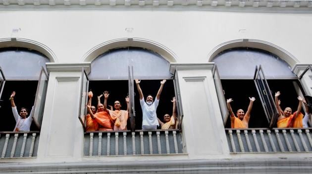 Monks of ISKCON (International Society for Krishna Consciousness) chant 'Hare Krishna' on the occasion of the Rath Yatra festiva, at ISCKON temple in Kolkata, Tuesday, June 23, 2020. The grand Rath Yatra festival procession is not organised this year due to the COVID 19 pandemic.  (PTI) 