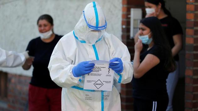 A member of a mobile testing unit of the German Army and German Red Cross is seen after testing residents for the coronavirus disease (COVID-19), following an outbreak of the disease at Toennies meat factory which remains under lockdown, in Guetersloh, Germany.(REUTERS)